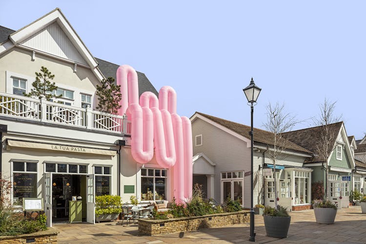 A larger-than-life art installation has landed at Bicester Village